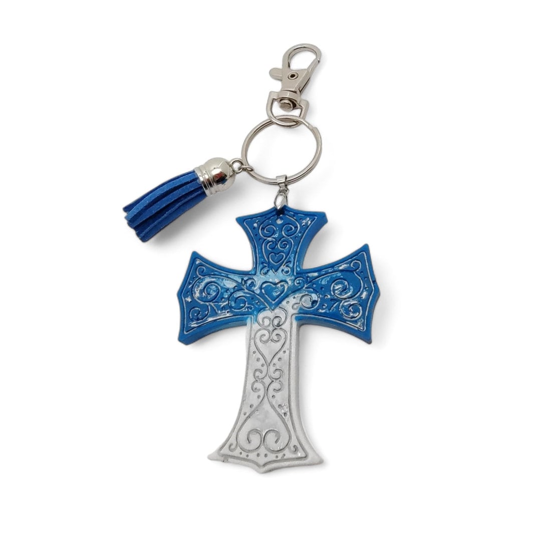Schlüsselanhänger Kreuz "Glück" aus Epoxidharz mit einer kleinen Quaste und einem Karabiner