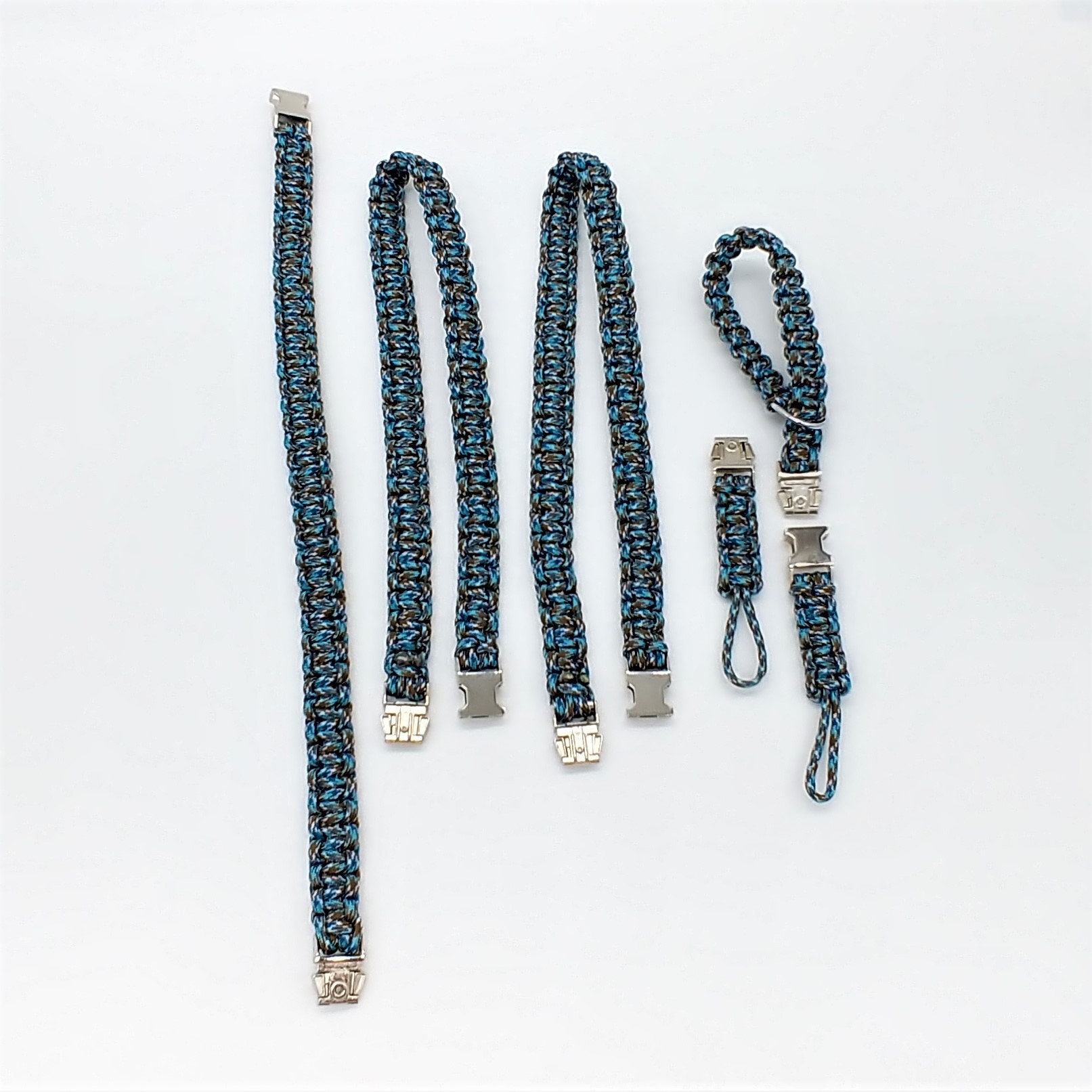 6 tlg. SET Kameragurt inkl. Handschlaufe geknotet aus Parachute Cord (Fallschirmschnur) Kamera Zubehör - Farbe "Türkis" 6 tlg. SET Kameragurt inkl. Handschlaufe geknotet aus Parachute Cord (Fallschirmschnur) Kamera Zubehör - Farbe "Türkis"